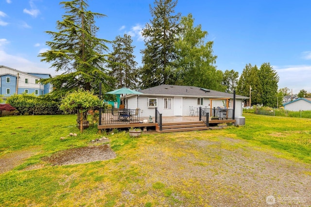 5809 162nd Ave E, Sumner, WA 98390 - rear view of property featuring a yard, a deck, and central air condition unit
