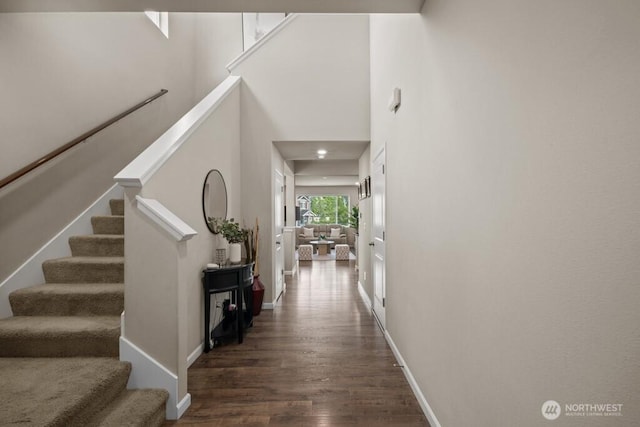 8657 Atlas Ave NE, Lacey, WA 98516 - foyer entrance with wood finished floors, stairway, baseboards, and a towering ceiling
