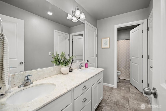8657 Atlas Ave NE, Lacey, WA 98516 - full bathroom with toilet, double vanity, baseboards, and a shower with shower curtain