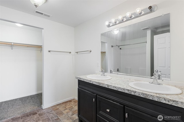600 S County Rd, Warden, WA 98857 - full bath with double vanity, a spacious closet, baseboards, and a shower