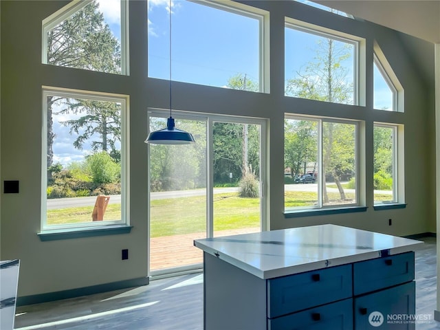 322 Fathom St NE, Ocean Shores, WA 98569 - doorway to outside featuring wood finished floors and a high ceiling