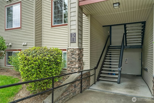 25025 SE Klahanie Blvd Unit D204, Sammamish, WA 98029 - doorway to property featuring stone siding
