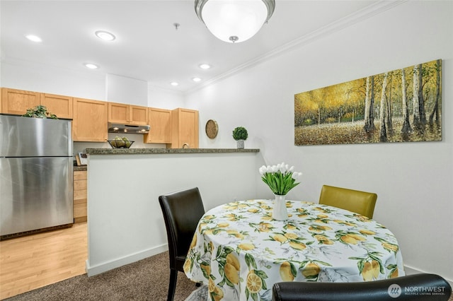 25025 SE Klahanie Blvd Unit D204, Sammamish, WA 98029 - dining space featuring ornamental molding, recessed lighting, light carpet, and baseboards