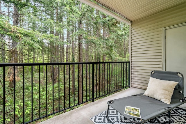 25025 SE Klahanie Blvd Unit D204, Sammamish, WA 98029 - balcony featuring a wooded view