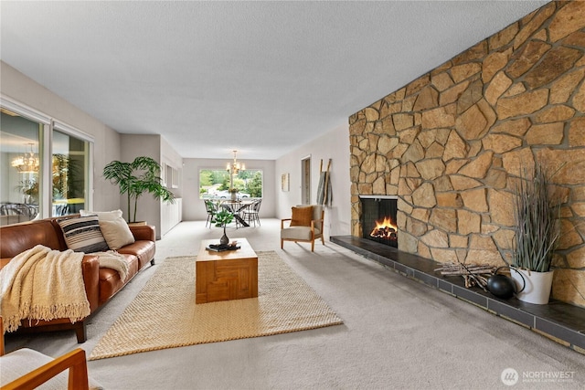 907 Baker St, Bellingham, WA 98225 - living area with a chandelier, a stone fireplace, carpet floors, and a textured ceiling