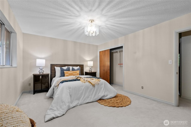 907 Baker St, Bellingham, WA 98225 - carpeted bedroom featuring a chandelier, a closet, and baseboards