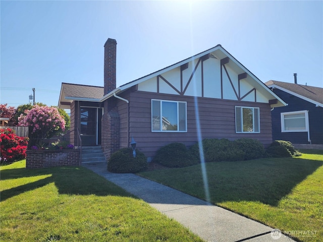 116 W 4th, Port Angeles, WA 98362 - view of front of home featuring a front lawn and a chimney