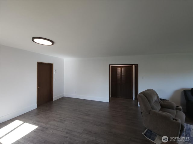 116 W 4th, Port Angeles, WA 98362 - living area featuring dark wood-style floors and baseboards