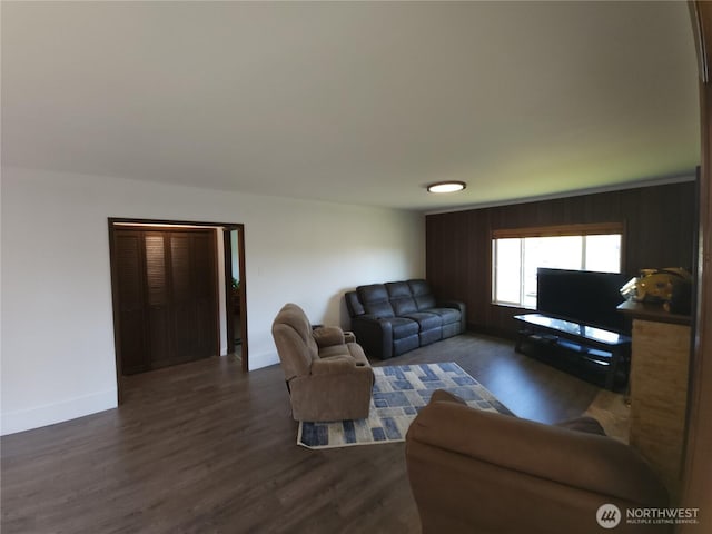 116 W 4th, Port Angeles, WA 98362 - living area with baseboards and dark wood-style flooring