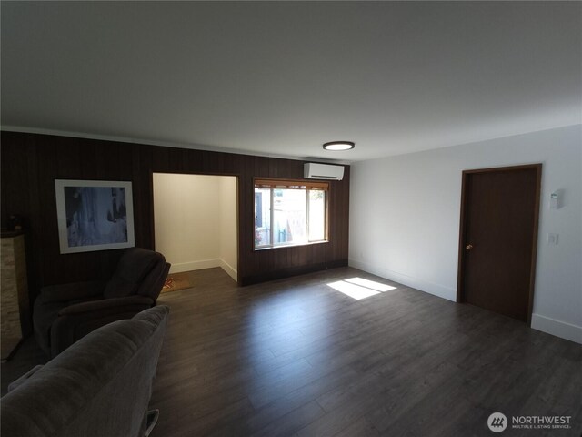 116 W 4th, Port Angeles, WA 98362 - living room with a wall unit AC, dark wood-type flooring, and wooden walls
