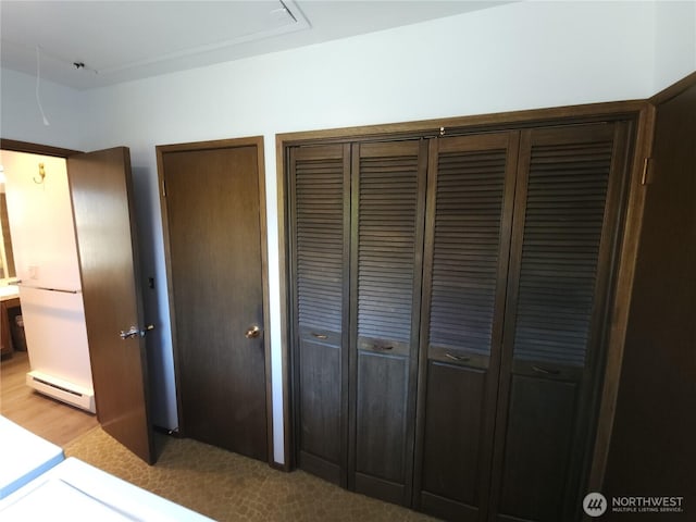 116 W 4th, Port Angeles, WA 98362 - unfurnished bedroom with baseboard heating and multiple closets
