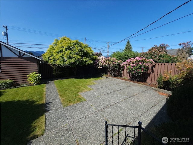116 W 4th, Port Angeles, WA 98362 - fenced backyard with a patio area
