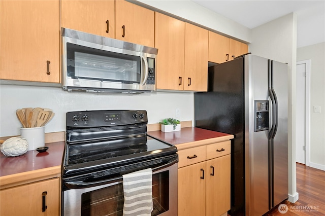 701 Galer St Unit 808, Seattle, WA 98109 - kitchen featuring appliances with stainless steel finishes, light brown cabinetry, and dark wood-style floors
