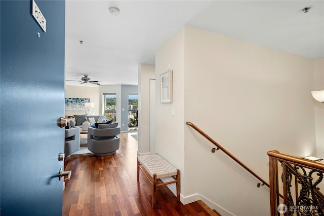 701 Galer St Unit 808, Seattle, WA 98109 - hallway with an upstairs landing, dark wood-style flooring, and baseboards
