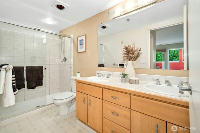 701 Galer St Unit 808, Seattle, WA 98109 - bathroom featuring double vanity, a stall shower, and toilet