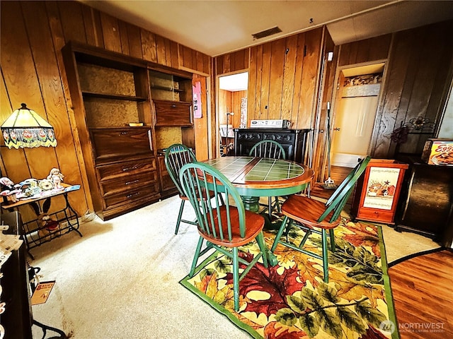 2003 2nd Ave W, Bremerton, WA 98312 - dining room featuring wooden walls, washer / clothes dryer, and light colored carpet