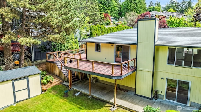 4528 SW 316th Pl, Federal Way, WA 98023 - rear view of property with a deck, a yard, a chimney, and a patio area