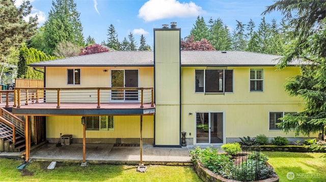 4528 SW 316th Pl, Federal Way, WA 98023 - rear view of house with a patio, a chimney, a lawn, and a deck