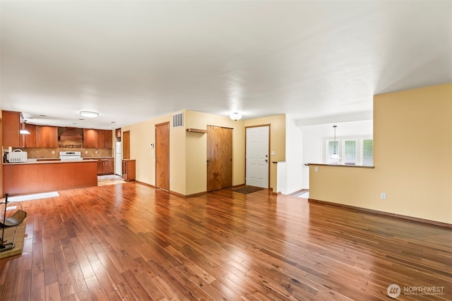 4528 SW 316th Pl, Federal Way, WA 98023 - unfurnished living room with wood-type flooring and baseboards