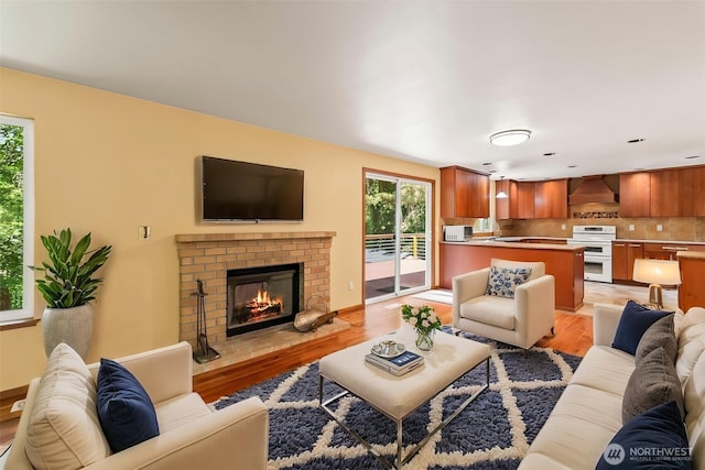4528 SW 316th Pl, Federal Way, WA 98023 - living room featuring light wood-style floors and a fireplace