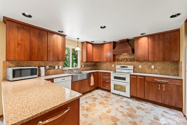 4528 SW 316th Pl, Federal Way, WA 98023 - kitchen featuring white appliances, custom exhaust hood, a sink, tasteful backsplash, and brown cabinets