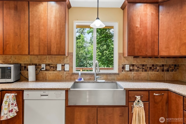 4528 SW 316th Pl, Federal Way, WA 98023 - kitchen with dishwasher, stainless steel microwave, a sink, tasteful backsplash, and brown cabinets