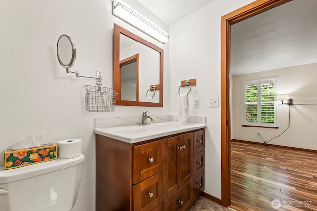 4528 SW 316th Pl, Federal Way, WA 98023 - half bath featuring toilet, vanity, wood finished floors, and baseboards