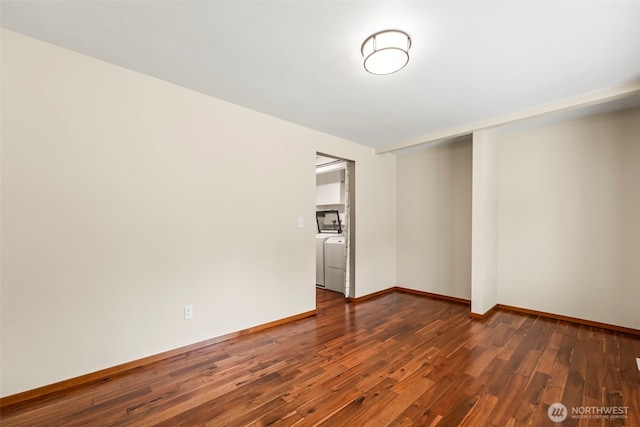 4528 SW 316th Pl, Federal Way, WA 98023 - empty room featuring dark wood-type flooring, washer / dryer, and baseboards