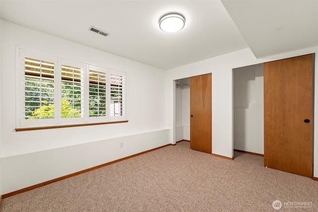 4528 SW 316th Pl, Federal Way, WA 98023 - unfurnished bedroom featuring carpet flooring, baseboards, and two closets