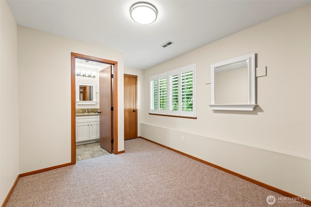 4528 SW 316th Pl, Federal Way, WA 98023 - unfurnished bedroom featuring light carpet, baseboards, a sink, and ensuite bath