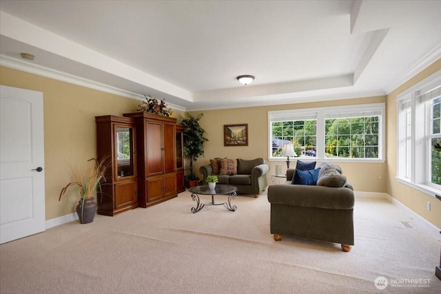 31045 219th Way SE, Black Diamond, WA 98010 - living room with a tray ceiling, light colored carpet, ornamental molding, and baseboards