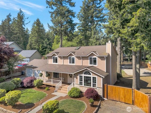 7611 176th Ave E, Bonney Lake, WA 98391 - view of front of property with covered porch, a chimney, stone siding, a garage, and roof with shingles