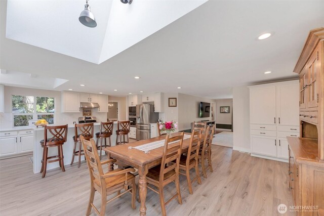 7611 176th Ave E, Bonney Lake, WA 98391 - dining room featuring light wood finished floors, recessed lighting, and a skylight