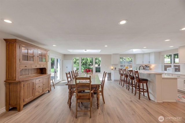 7611 176th Ave E, Bonney Lake, WA 98391 - dining space with a skylight, light wood-style flooring, and recessed lighting