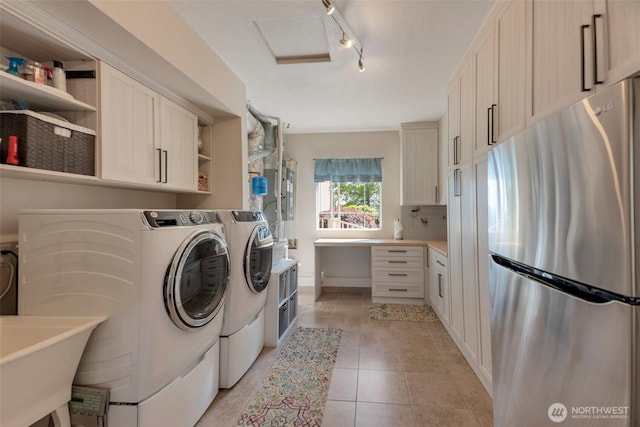 7611 176th Ave E, Bonney Lake, WA 98391 - washroom with separate washer and dryer, light tile patterned floors, rail lighting, and attic access