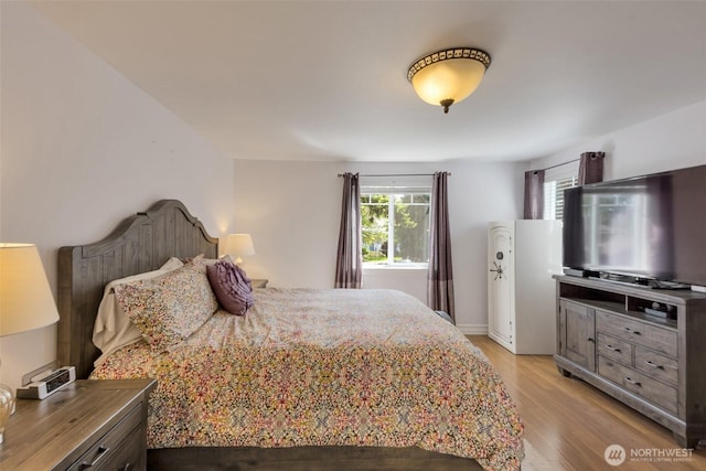 7611 176th Ave E, Bonney Lake, WA 98391 - bedroom featuring light wood finished floors