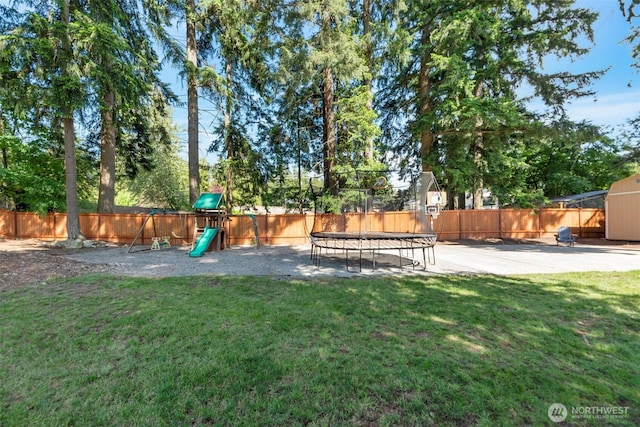 7611 176th Ave E, Bonney Lake, WA 98391 - view of yard featuring a trampoline and a playground