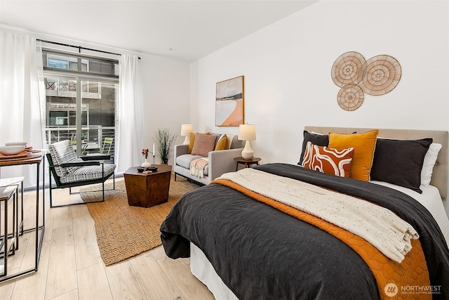 1414 12th Ave Unit 504, Seattle, WA 98122 - bedroom with light wood-type flooring and access to exterior