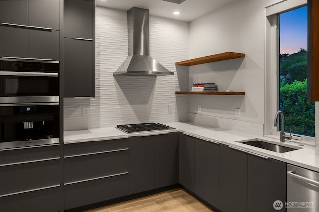 8926 NE 36th St, Yarrow Point, WA 98004 - kitchen featuring wall chimney range hood, a sink, stainless steel appliances, modern cabinets, and recessed lighting