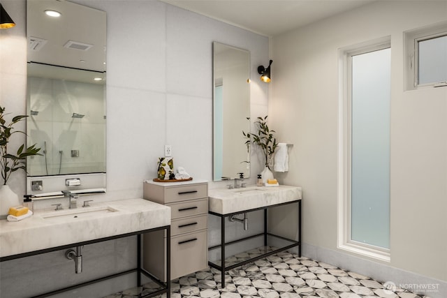 8926 NE 36th St, Yarrow Point, WA 98004 - full bath with a shower, two vanities, tile patterned floors, and baseboards