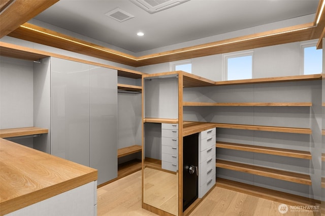 8926 NE 36th St, Yarrow Point, WA 98004 - walk in closet with light wood-type flooring