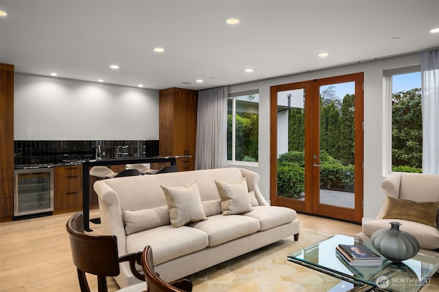 8926 NE 36th St, Yarrow Point, WA 98004 - living area with wine cooler, recessed lighting, and light wood-style flooring