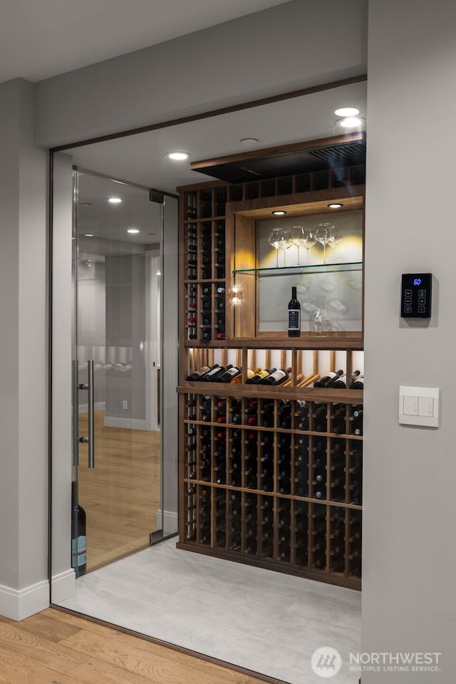 8926 NE 36th St, Yarrow Point, WA 98004 - wine room with wood finished floors, baseboards, and recessed lighting