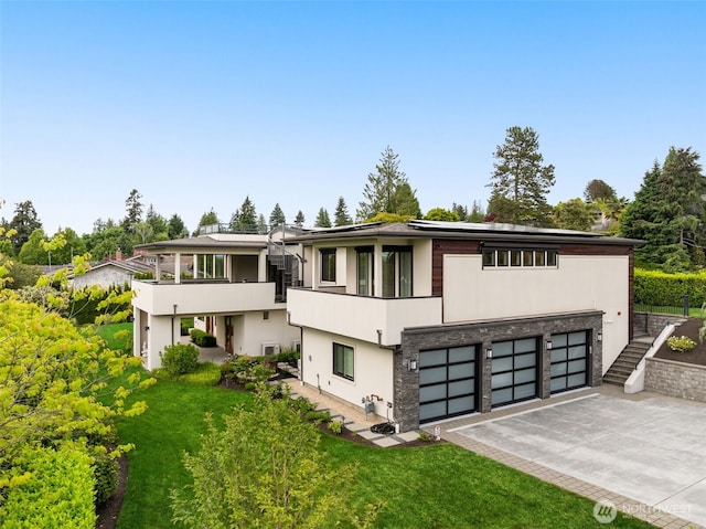 8926 NE 36th St, Yarrow Point, WA 98004 - contemporary house with asphalt driveway, a garage, solar panels, a balcony, and stairway
