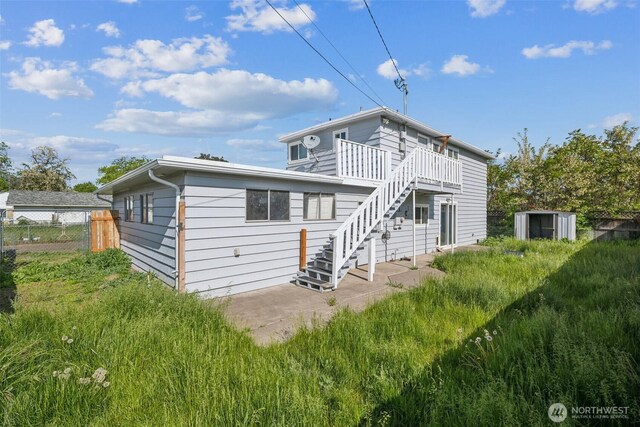 47 SE 10th St, College Place, WA 99324 - back of house featuring stairway, a deck, and a patio