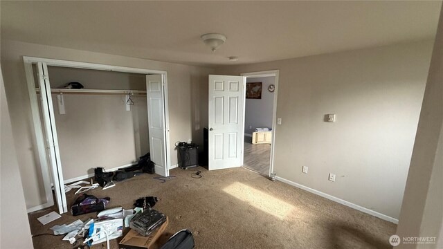 47 SE 10th St, College Place, WA 99324 - unfurnished bedroom featuring carpet flooring, baseboards, and a closet