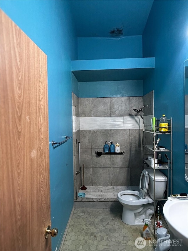 19904 13th Avenue Ct E, Spanaway, WA 98387 - full bath featuring toilet, a shower stall, and tile patterned floors