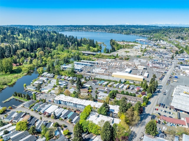 aerial view of property and surrounding area with a nearby body of water