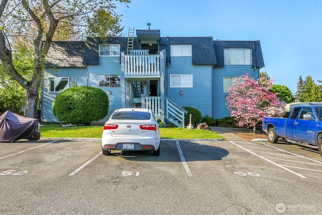 view of property with uncovered parking