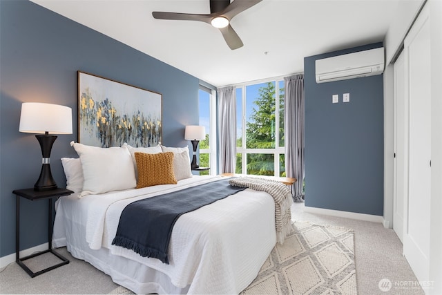 1406 21st Ave Unit A, Seattle, WA 98122 - bedroom featuring a wall mounted air conditioner, floor to ceiling windows, light carpet, baseboards, and a closet